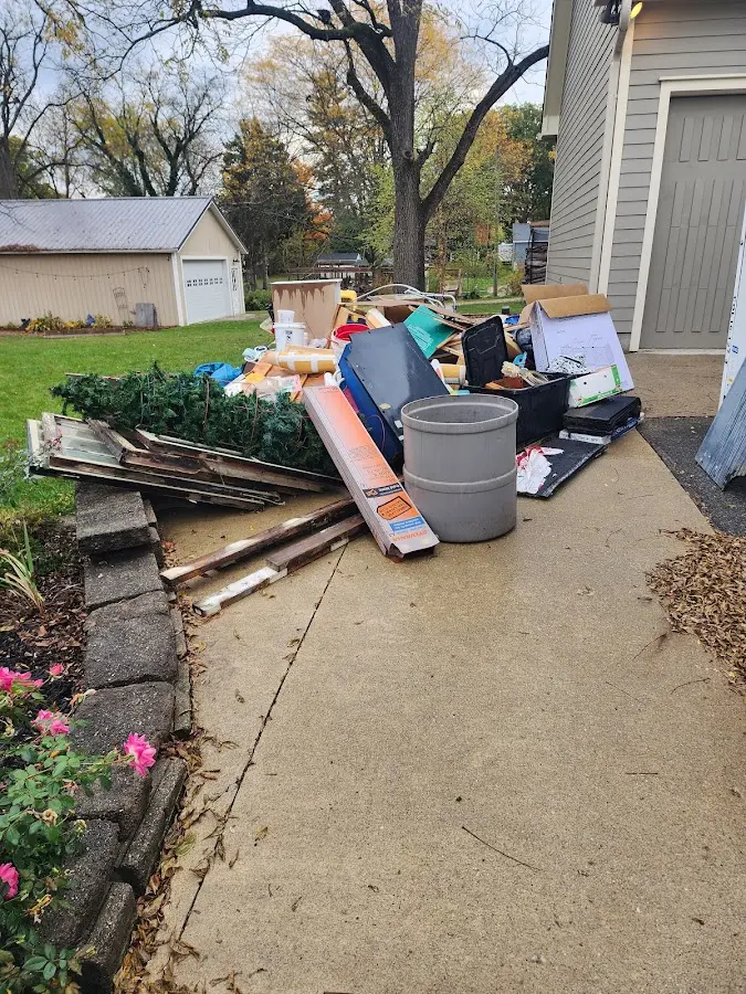 Dumpster being loaded with debris for 3 Yard Dumpster Rental in Ulysses